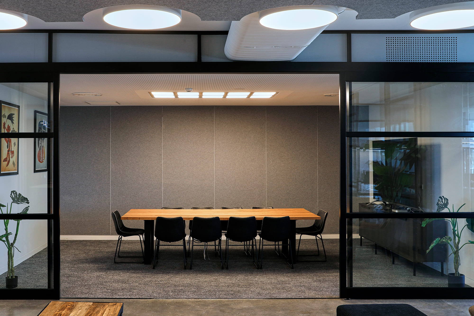 Long table in boardroom with sliding glass doors